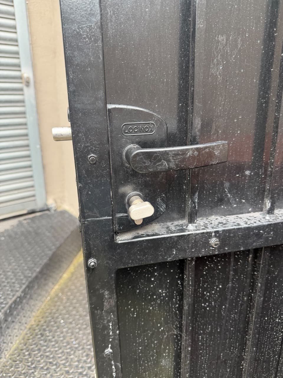 Locinox lock and thumbturn fitted on a black metal gate